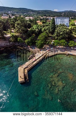 Beautiful panoramic view of Lovran village and its sea shore in Croatia. Top view photo taken on drone.
