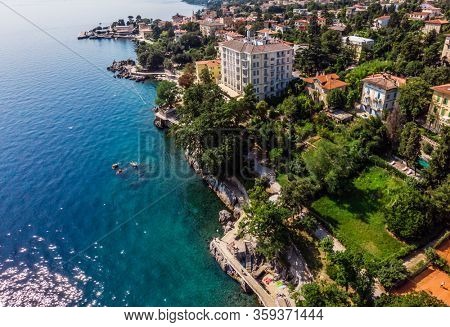 Beautiful panoramic view of Lovran village and its sea shore in Croatia. Top view photo taken on drone.