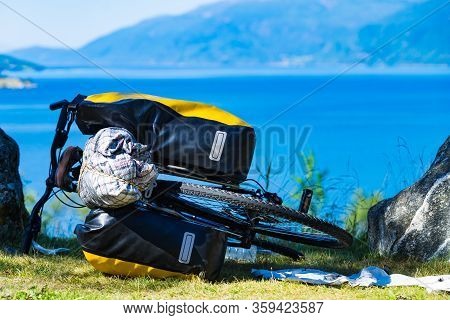 Mountain Bicycle With Attached Bag Saddlebag Against Nature, Mountains Fjord Landscape In Norway