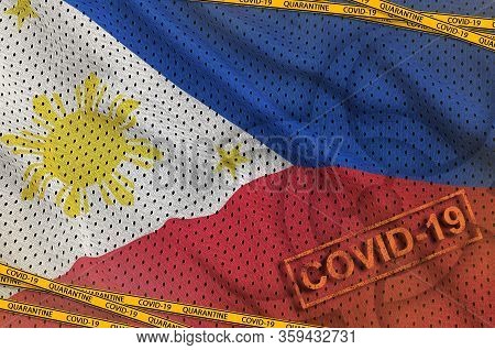 Philippines Flag And Covid-19 Biohazard Symbol With Quarantine Orange Tape And Stamp. Coronavirus Or