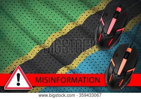 Tanzania Flag And Two Computer Mouses. Misinformation During Coronavirus Or 2019-ncov Virus Concept