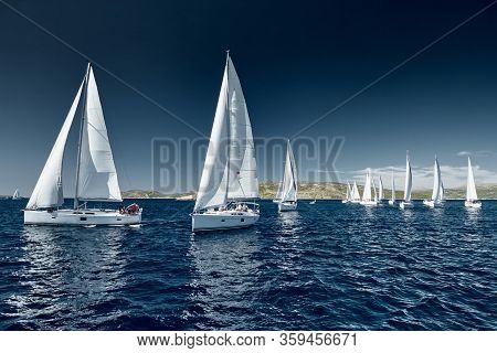 Sailboats Compete In A Sail Regatta At Sunset, Race Of Sailboats, Reflection Of Sails On Water, Mult