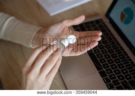 Woman Applying Sanitizer Disinfecting Hands, Killing Coronavirus Grippe Flu Bacterium.