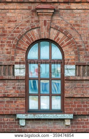 Window With An Arch On The Background Wall Of Brown Brick. From The Series Window Of Saint-petersbur