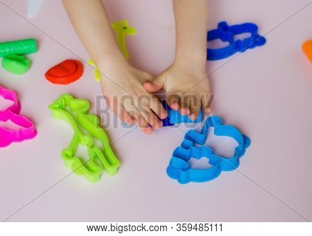 Child Hands Playing With Colorful Clay. Homemade Plastiline. Girl Molding Modeling Clay. Homemade Cl