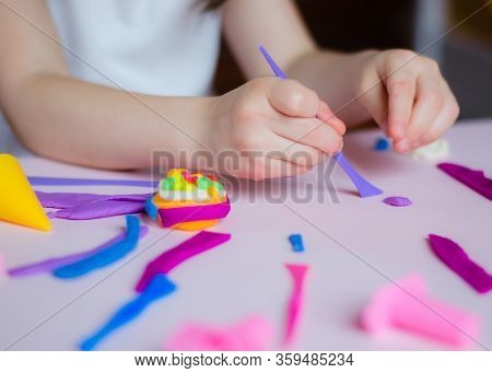 Child Hands Playing With Colorful Clay. Homemade Plastiline. Girl Molding Modeling Clay. Homemade Cl