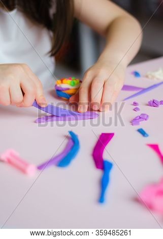 Child Hands Playing With Colorful Clay. Homemade Plastiline. Girl Molding Modeling Clay. Homemade Cl