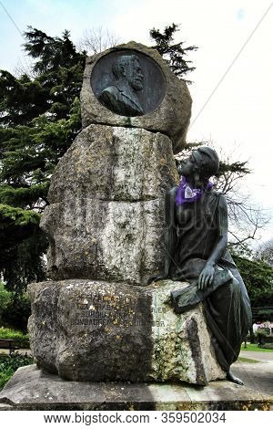 Lisbon, Portugal- March 4, 2020: Franga Borges Statue With Purple Scarf Tied Around The Neck For Int