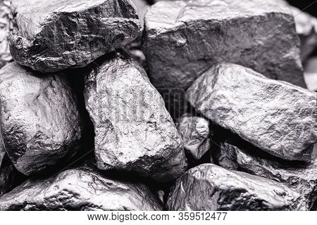 Raw Manganese. Manganese Stone Isolated On Black Background. Mineral Extraction Of Heavy Metals From