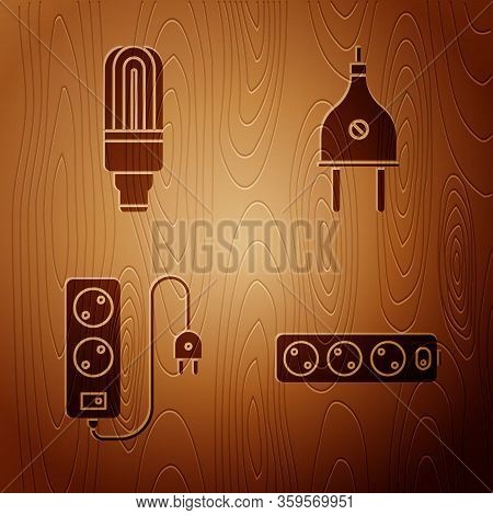 Set Electric Extension Cord, Led Light Bulb, Electric Extension Cord And Electric Plug On Wooden Bac