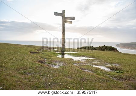 Signpost On Top Of A Hill In A Park England.