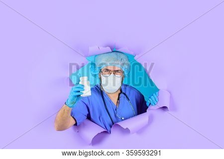 Through Paper. Doctor With Pills. Medicine. Nurse. Bottle Of Pills. Treatment Pill. Pharmaceutical D