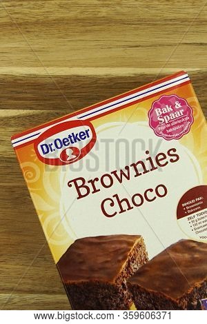 Zaandam, The Netherlands - April 4, 2020: Package Of Dr. Oetker Brownies Choco Against A Wooden Bacl