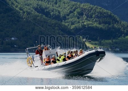 Flam, Norway - June 08,2012: Tourists Enjoy The Safari Tour By Speed Boat At The Aurlandsfjord In Fl