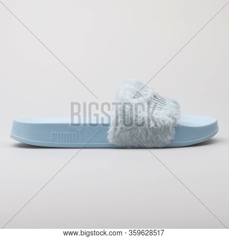 Vienna, Austria - August 15, 2017: Puma Fur Slide Blue Sandals On White Background.
