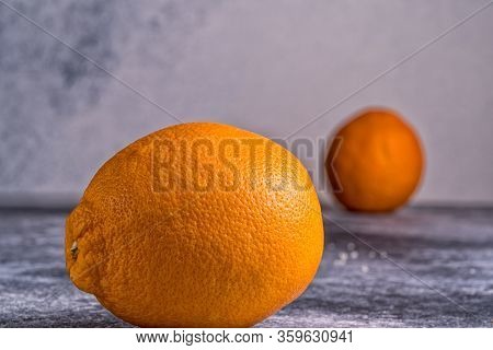 Clop Fresh Orange Fruit On Gray Background.
