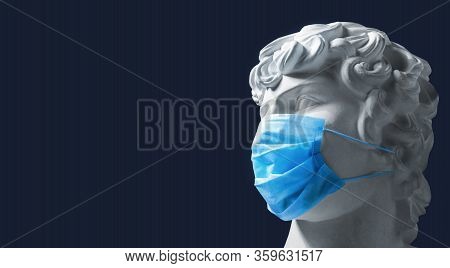Coronavirus. Ancient Greek Plaster Head In A Medical Mask, Place For Text. European Pandemic. Sculpt