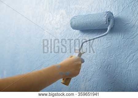 Paint Roller On Plaster Textured Background, Free Space