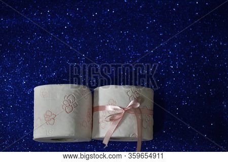 Rolls Of Toilet Paper On Glitter Blue Background