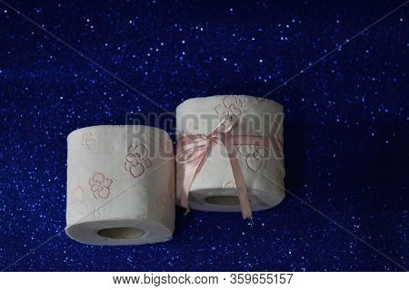 Rolls Of Toilet Paper On Glitter Blue Background