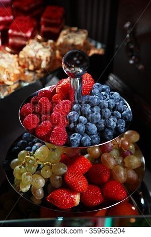 Vase With Berries. Catering Services For Events. Photo On A Dark Background. Field Service. Copy Of 