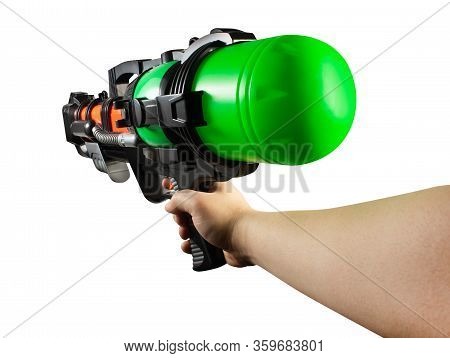 Isolated photo of hand holding a plastic multi-colored water gun on white background first person view.
