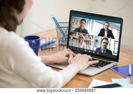 Woman Working From Home Participating In Group Video Call