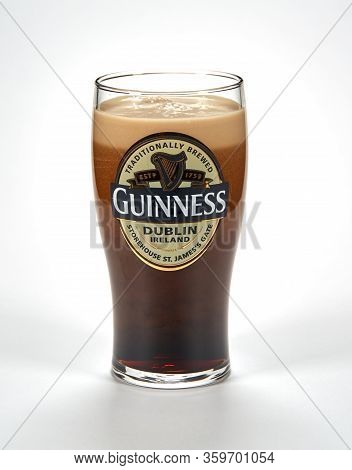 Montreal, Canada - March 15, 2020: An Originall Guinness Glass Of Dark Stout Beer. Guinness Is A Dar