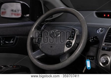 Novosibirsk, Russia - April 02, 2020:   Toyota Prius,  Auto Interior: Steering Wheel With Red Logo  