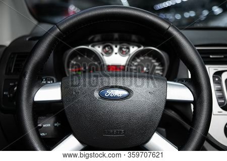 Novosibirsk, Russia - March 04, 2020:   Ford Kuga,  Auto Interior: Steering Wheel With Red Logo Ford