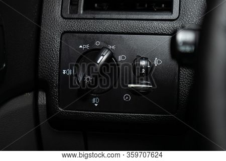 Novosibirsk, Russia - March 04, 2020:   Ford Kuga,  Close-up Of The  Headlight Setting Buttons. Mode