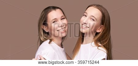 Elder Mother And Teenager Daughter Hug. Happy Family Portrait. Similar Smile. Next Generation Love. 