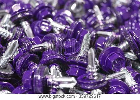 Macro Shot Of A View Of Roofing Screws Background Texture. Blue Roofing Screws Background. А Bunch O