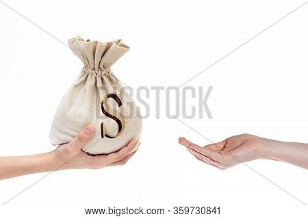 Hand On A White Background Gives A Bag Of Money To An Empty Hand, Lend Money, Concept Of Bank Loan, 