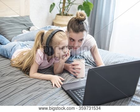 Schoolgirl Studying At Home Using Laptop. Stay At Home. Online Education, Home Education, Quarantine