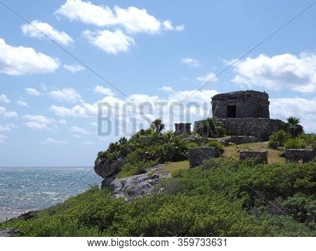 Temple Of God Of Winds At Promontory In City Of Tulum At Quintana Roo In Mexico, Cloudy Blue Sky In 