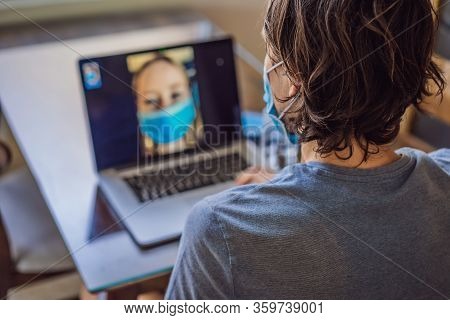 Coronavirus. Man In Quarantine For Coronavirus Wearing Protective Mask. Shes Working From Home And U