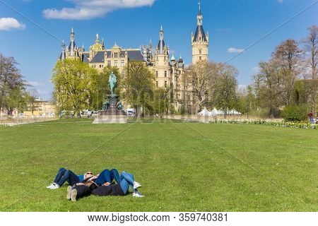 Schwerin, Germany - April 16, 2019: People Relaxing In The Castle Garden Of Schwerin, Germany