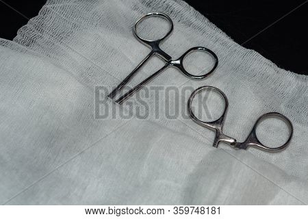 Surgical Instruments Covered With Gauze. Lying On The Table In The Operating Room