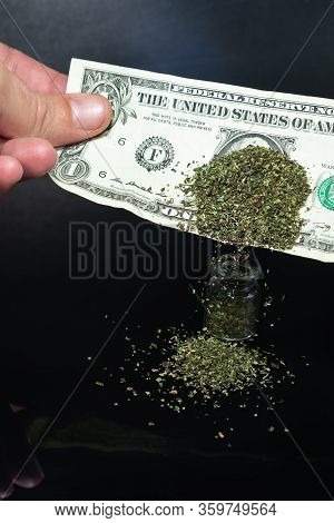 Snus - Grated Moistened Powder And Chewing Tobacco On A Dollar Background. Smuggling Concept