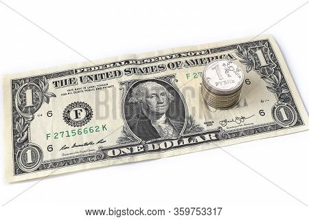 Coin Ruble On The Background Bills Dollar.