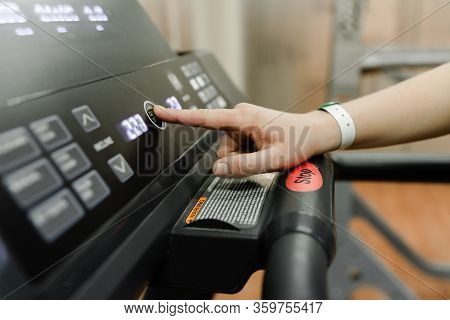 Get Ready To Run- Hand Pushes The Green Start Button On A Treadmill In A Home Gym, Hand Click Stop B