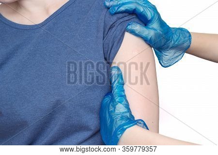 Doctor Or Nurse Examine Tuberculosis Vaccine Bcg Marks On The Shoulder Of An Adult Woman Made In Chi