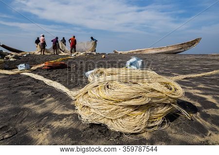 Varkala, India - February 25-2017 : Fishing Net With Fishermen On Backside. Odayam Beach, Varkala, I