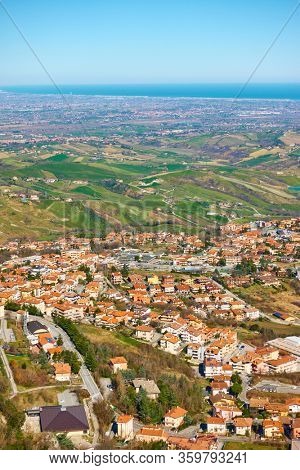 Roofs of Borgo Maggiore in San Marino and valley of Emilia-Romagna in Italy
