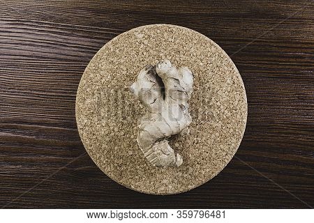 Fresh Ginger Root On Wooden Table Background, Antivir. Naturally Elevating Your Energy Levels, Close
