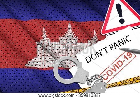 Cambodia Flag And Police Handcuffs With Inscription Dont Panic On White Paper. Coronavirus Or 2019-n