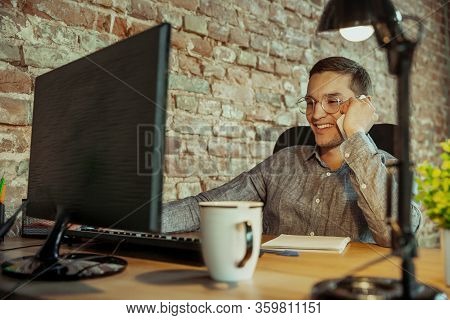 Talking On Phone. Man Working From Home During Coronavirus Or Covid-19 Quarantine, Remote Office Con