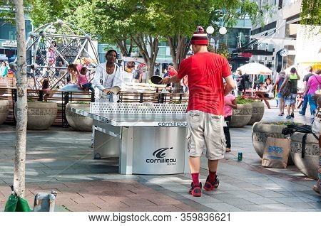 Seattle, Wa Usa August 23, 2014:  Men Enjoy The Table Tennis Or Ping Pong Game In Occidental Park In
