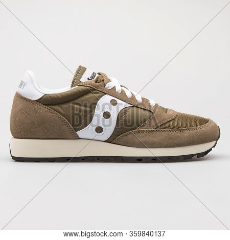 Vienna, Austria - August 6, 2017: Saucony Jazz Original Vintage Smu Olive Green And White Sneaker On
